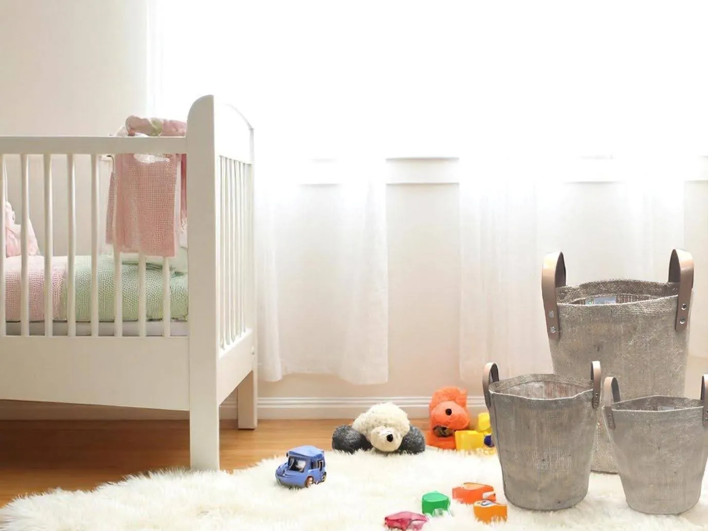 Three bucket totes in a room